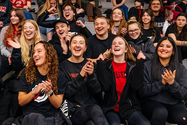 Students cheering at an activity