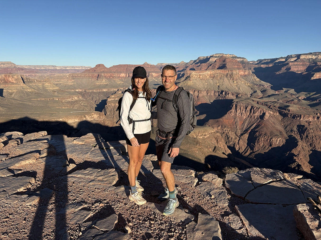 Sandy Korbel poses with husband Brian Korbel on the south rim of the Grand Canyon